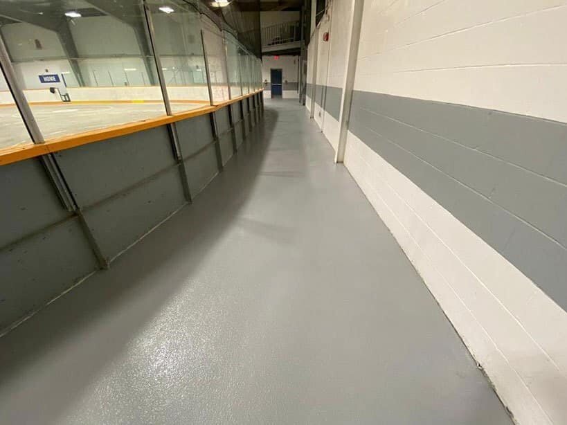 Durable gray epoxy floor in a commercial corridor
