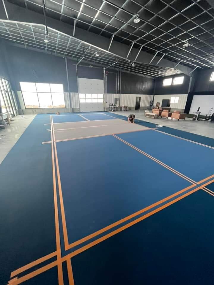 Blue resinous sports floor with bright line markings