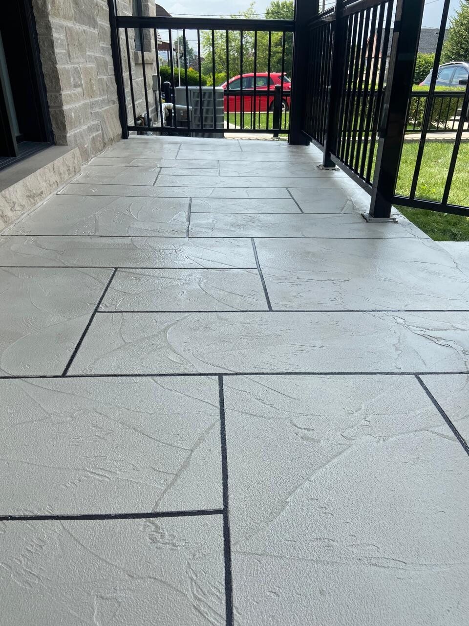 Decorative concrete walkway with a custom rectangular pattern