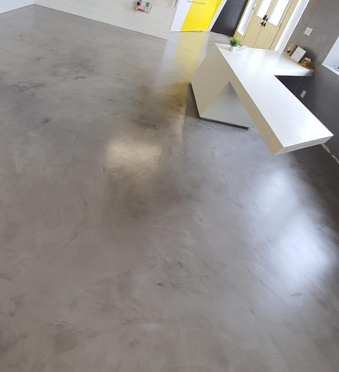 Gray microcement floor in a contemporary kitchen