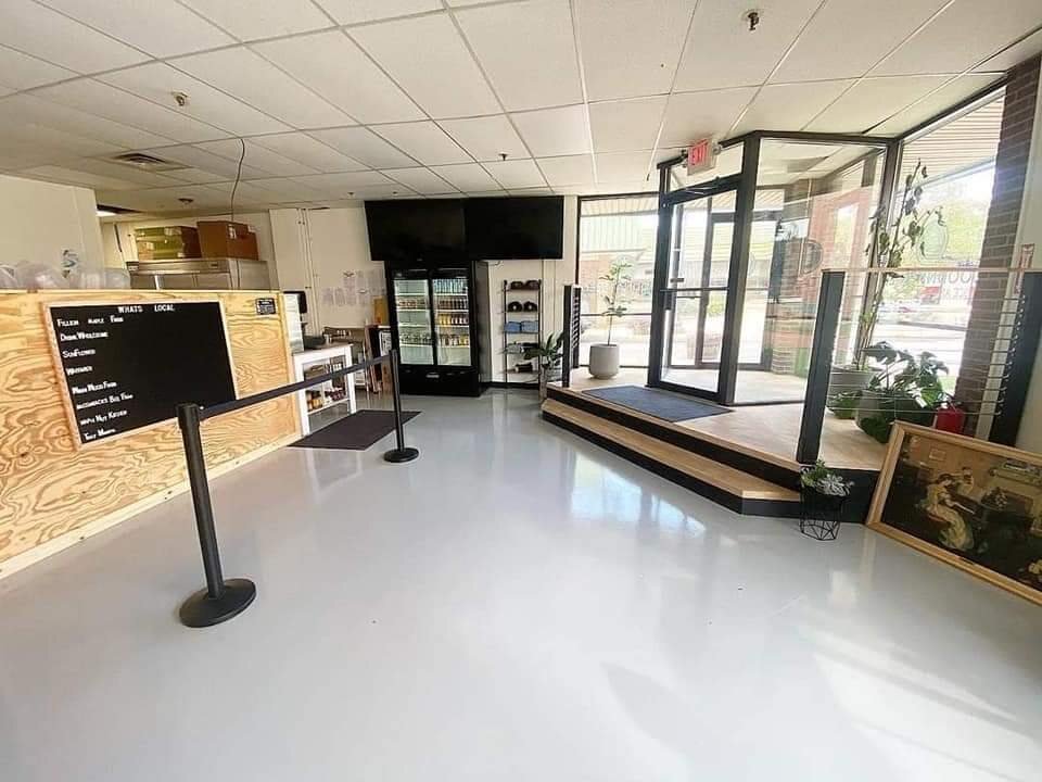 Bright polished concrete floor in a finished retail interior